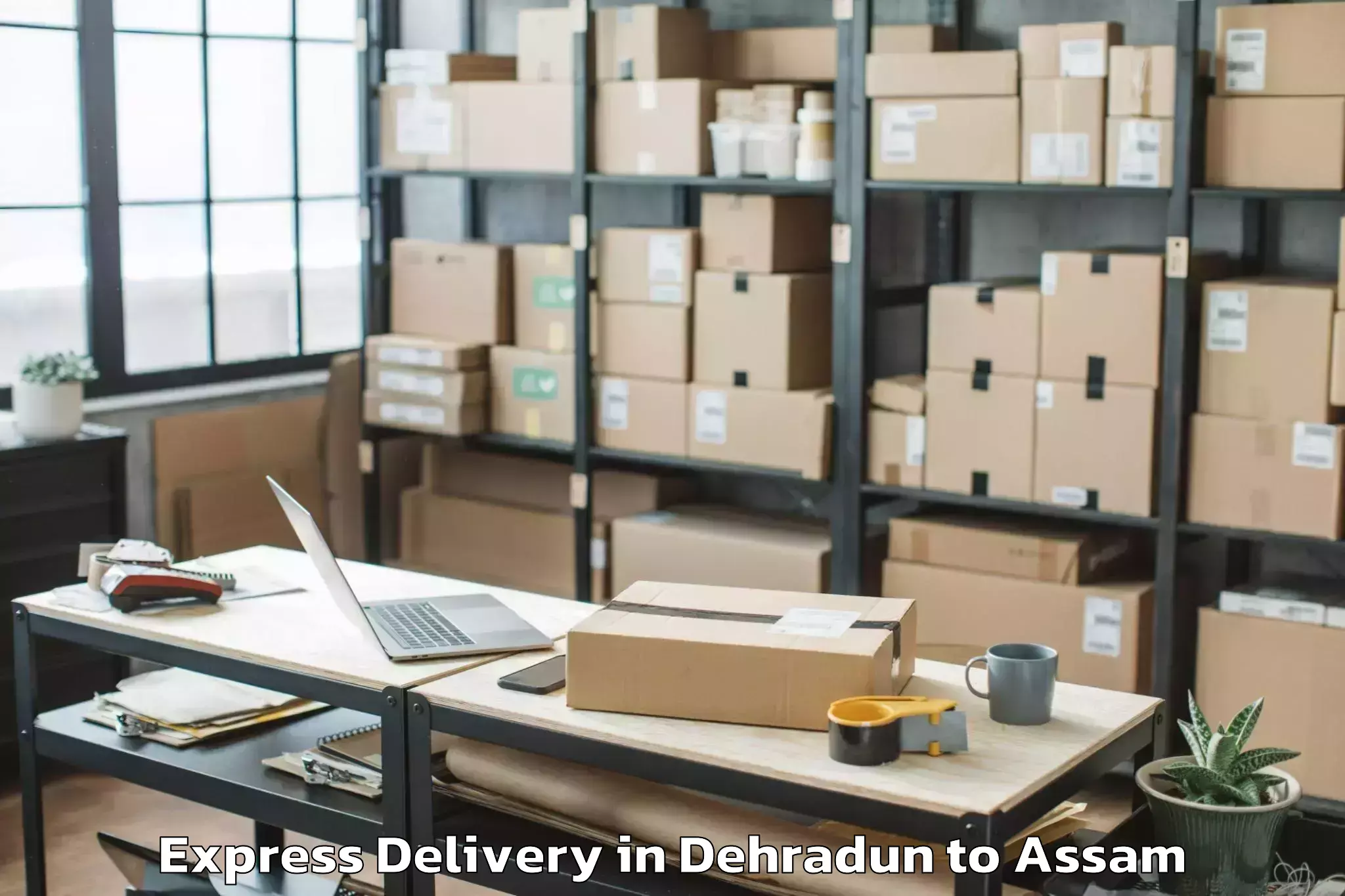 Affordable Dehradun to Gossaigaon Express Delivery